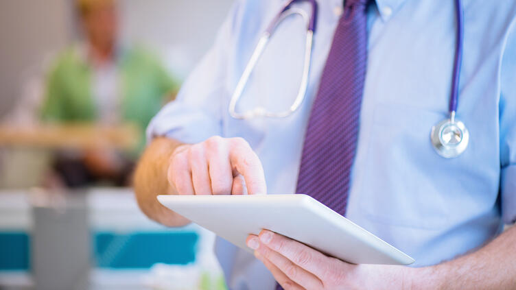 Healthcare professional using tablet