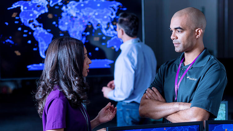 Analysts discussing geospatial data