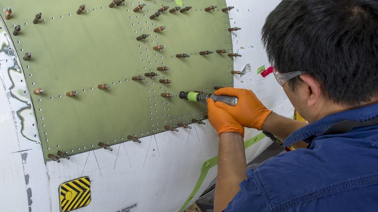 Man working on plane