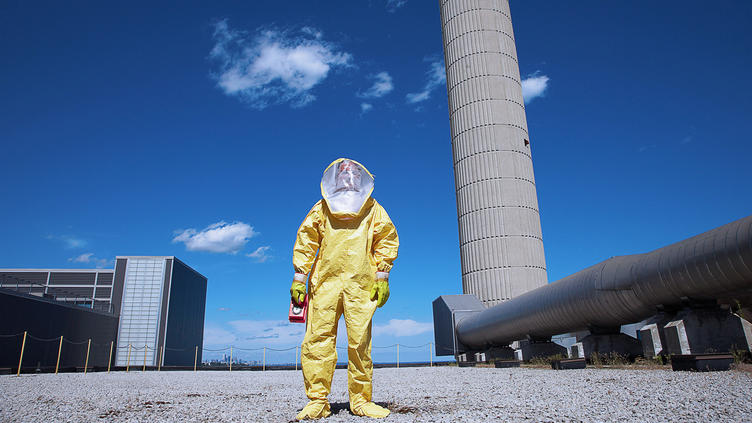 Person in yellow hazmat suitow