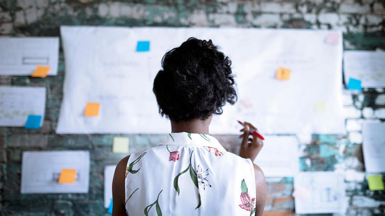 Woman looking at board