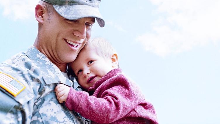 Military personnel with young child