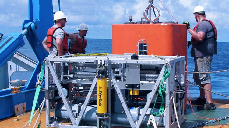 TRAPS system onboard a boat with three men with life vests on