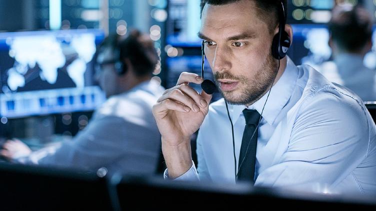 man with headset at computer