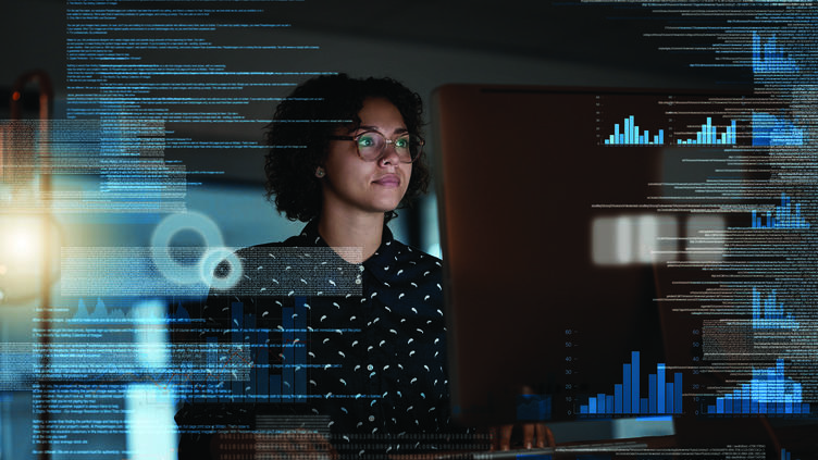 woman analyzing data at computer