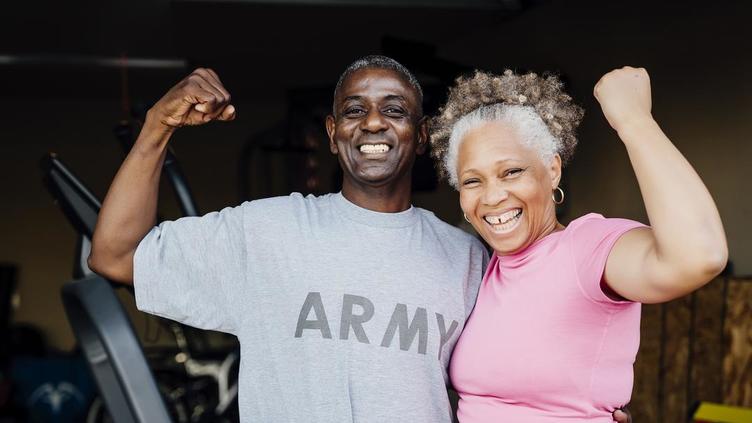 Man with Army shirt working out with his wife