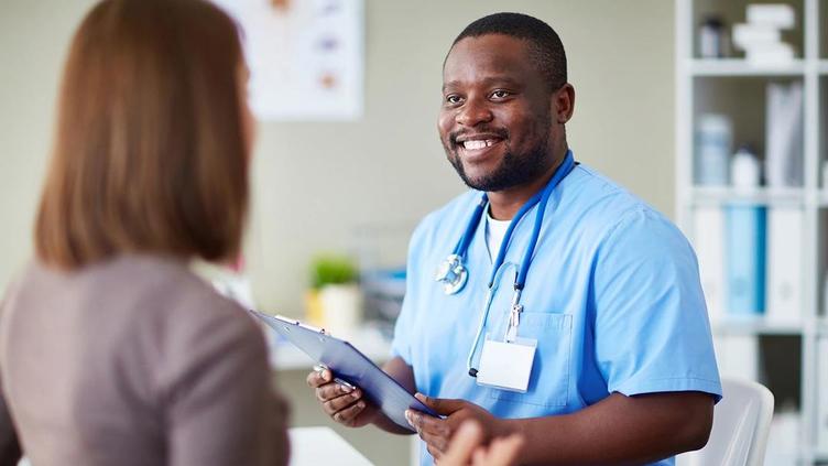 Doctor discussing data with female patient