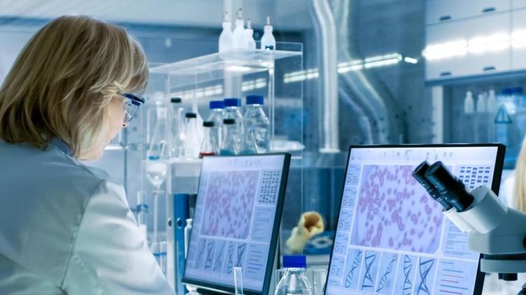 Scientist looking at healthcare data on a computer screen