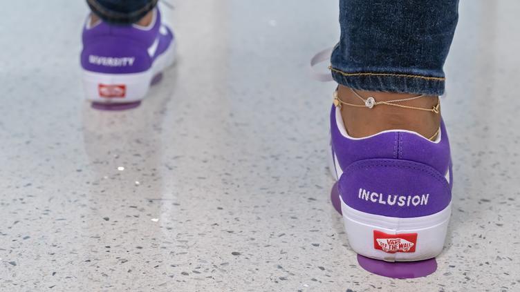 Image of sneakers with inclusion and diversity imprinted on the heels
