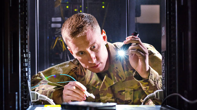 man in server cabinet