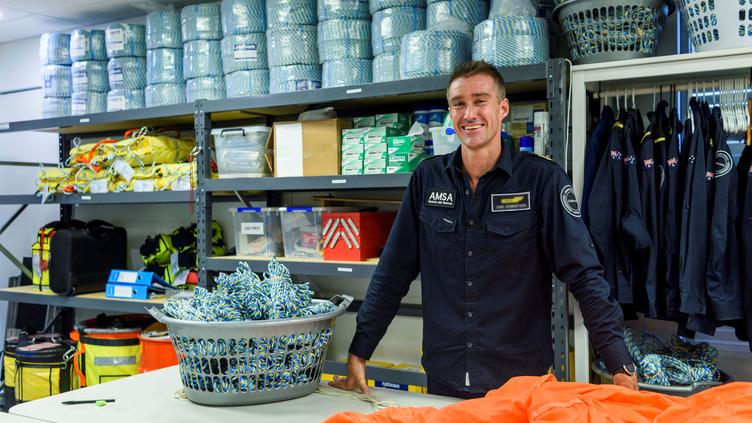 Man in storeroom smiling