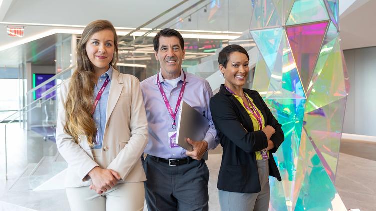 Actors portraying Leidos employees collaborating at the global headquarters in Reston, VA.